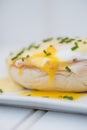 Eggs Benedict toasted English muffins ham poached eggs and hollandaise sauce Royalty Free Stock Photo