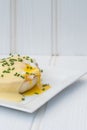 Eggs Benedict toasted English muffins ham poached eggs and hollandaise sauce Royalty Free Stock Photo