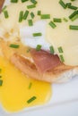 Eggs Benedict toasted English muffins ham poached eggs and hollandaise sauce Royalty Free Stock Photo