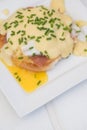 Eggs Benedict toasted English muffins ham poached eggs and hollandaise sauce Royalty Free Stock Photo