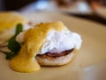 Eggs Benedict, a traditional American breakfast on white plate Royalty Free Stock Photo