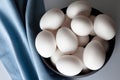 Eggs in a bowl with blue napkin from above Royalty Free Stock Photo