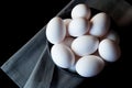 Eggs in a bowl on grey napkin from above Royalty Free Stock Photo
