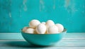 Eggs in a bowl on a surface resembling vintage turquoise.