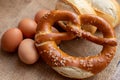 eggs, buns and pretzel lie in burlap Royalty Free Stock Photo