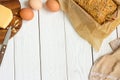 Eggs, Cheese and Homemade Gluten free Sweet Bread in the Baking Dish on a Light White Wooden Background. Rural Kitchen or Bakery - Royalty Free Stock Photo