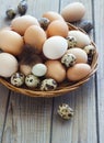 Eggs from chicken and quail farm in a wicker basket