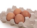 Eggs in compartment paper tray package on white background Royalty Free Stock Photo