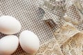 Eggs and cookie cutters on a traditional checkered cloth