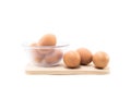 Eggs in cup on wood square Royalty Free Stock Photo