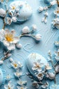 Eggs of a delicate blue color, decorated with branches with apple flowers on a blue background Royalty Free Stock Photo