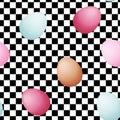 eggs of different colors on black and white racing and checkered pattern background.