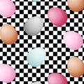 Eggs of different colors on black and white racing and checkered pattern background.