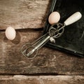Eggs and an egg beater Royalty Free Stock Photo