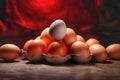 Eggs in egg carton on wooden table with red background Royalty Free Stock Photo