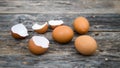 Eggs and egg shells are placed in groups on a wooden plate Royalty Free Stock Photo
