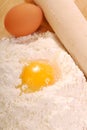 Eggs and flour with a rolling pin