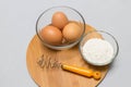 Eggs and flour on white table background. basic baking background. Royalty Free Stock Photo