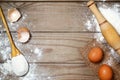 Eggs, flour on the wooden table. Royalty Free Stock Photo