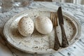 eggs, fork and knife on a plate with dried leaves, in the style of dreamy and romantic compositions, polished concrete Royalty Free Stock Photo