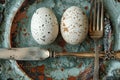 eggs, fork and knife on a plate with dried leaves, in the style of dreamy and romantic compositions, polished concrete Royalty Free Stock Photo