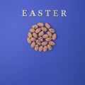 The eggs form a circle on a purple background with the word EASTER. Minimalistic Easter scene