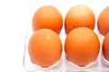 Eggs form refrigerator with water droplets on white background