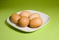 Eggs on fresh green background Royalty Free Stock Photo