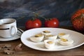 Cooked egg and tomato on a wooden table