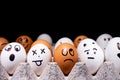Eggs with funny expressions simulating human faces. Concept of ethnic diversity and moods Royalty Free Stock Photo