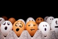 Eggs with funny expressions simulating human faces. Concept of ethnic diversity and moods Royalty Free Stock Photo