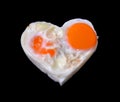 Eggs, heart black background Royalty Free Stock Photo
