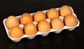 Eggs isolated on a black background. The food product has an oval shape