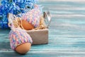 Eggs in knitted hats, flowers