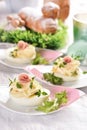 Eggs with mayonnaise stuffed with vegetable salad on Easter table Royalty Free Stock Photo