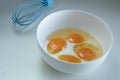 Eggs and milk in a plate. The process of preparing an omelet for breakfast Royalty Free Stock Photo