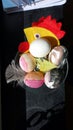 Eggs painted with a cloth hen in the background to wish everyone happy Easter Royalty Free Stock Photo