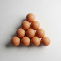 Eggs are positioned with four at the base followed by three two Royalty Free Stock Photo