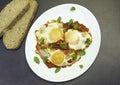 `Eggs in Purgatory`, a traditional Mediterranean breakfast dish of eggs poached over a spicy tomato sauce topped with melted chees