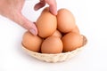 Eggs in rattan basket a healthy food gift on white backgrounds