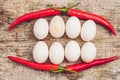 Eggs and red pepper in the form of a mouth with teeth. One of the teeth is sick in the form of a cracked egg. Sick tooth concept Royalty Free Stock Photo