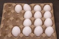 Eggs in a row inside a carton box. Side view Royalty Free Stock Photo