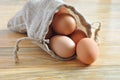 Eggs in a Sack on Top of Rustic Wood