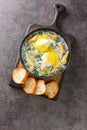 Eggs Sardou is a Louisiana Creole cuisine dish made with poached eggs, artichoke bottoms, creamed spinach and Hollandaise sauce Royalty Free Stock Photo