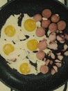 Eggs and sausage slices