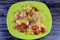 Eggs scrambled with tomatoes, a dish made from eggs stirred, whipped or beaten together while being gently heated, with salt, Royalty Free Stock Photo