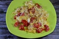 Eggs scrambled with tomatoes, a dish made from eggs stirred, whipped or beaten together while being gently heated, with salt, Royalty Free Stock Photo