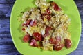 Eggs scrambled with tomatoes, a dish made from eggs stirred, whipped or beaten together while being gently heated, with salt, Royalty Free Stock Photo