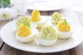 Eggs stuffed with cheese and avocado mousse on Easter table Royalty Free Stock Photo