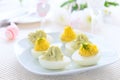 Eggs stuffed with cheese and avocado mousse on Easter table Royalty Free Stock Photo